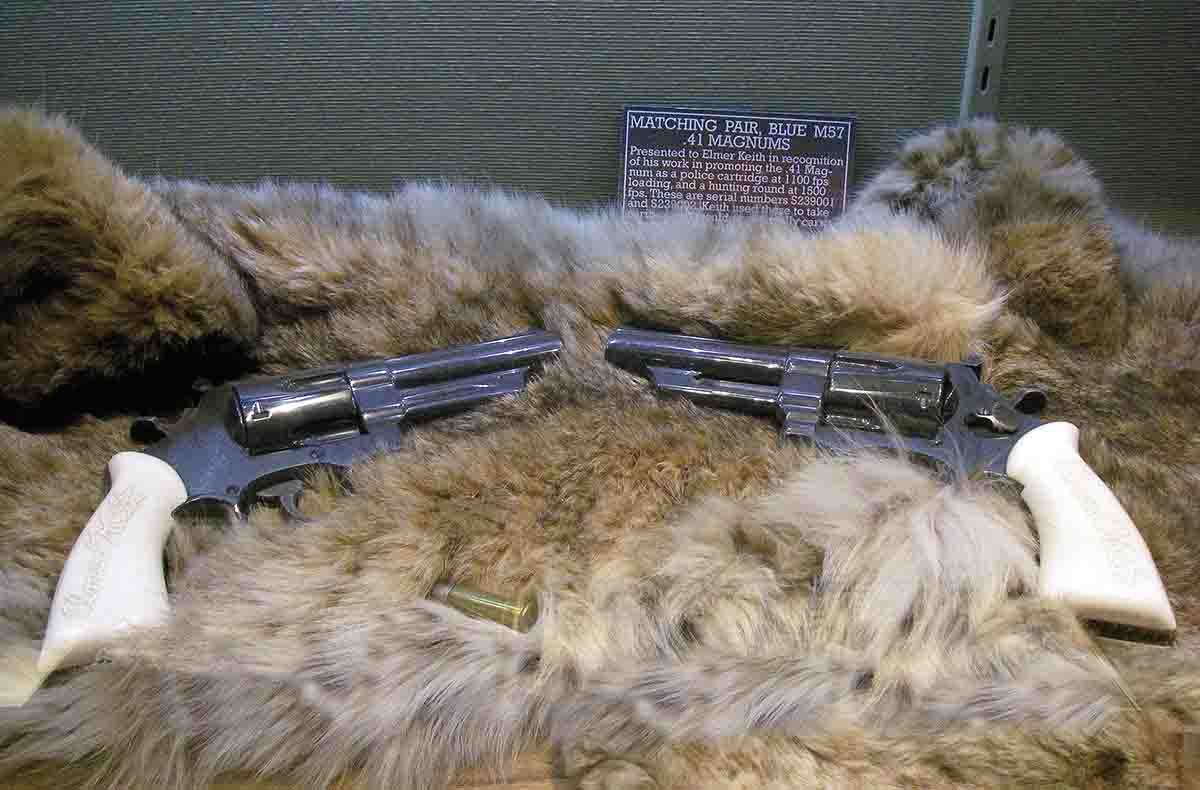 This matching pair of Smith & Wesson Model 57 .41 Magnum revolvers feature ivory stocks carved with the signature of Elmer Keith.